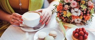 Cup of coffee and bouquet of flowers on the table